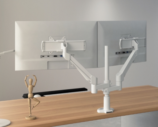 Image of a dual-arm monitor arm on a desk