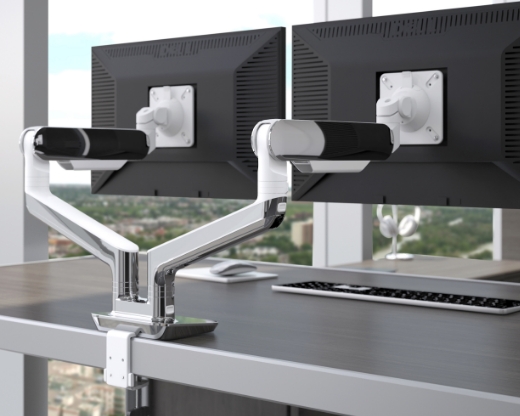 Image of a dual-arm monitor arm on a desk