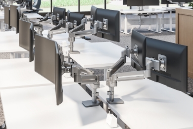 Image of a dual monitor arm attached to a desk