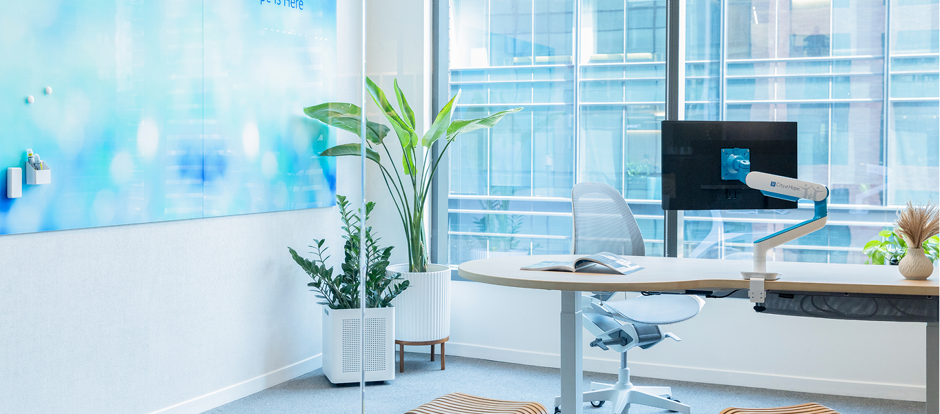 Image of an office with a custom ID markerboard, Elea Chair, and Rising Monitor Arm
