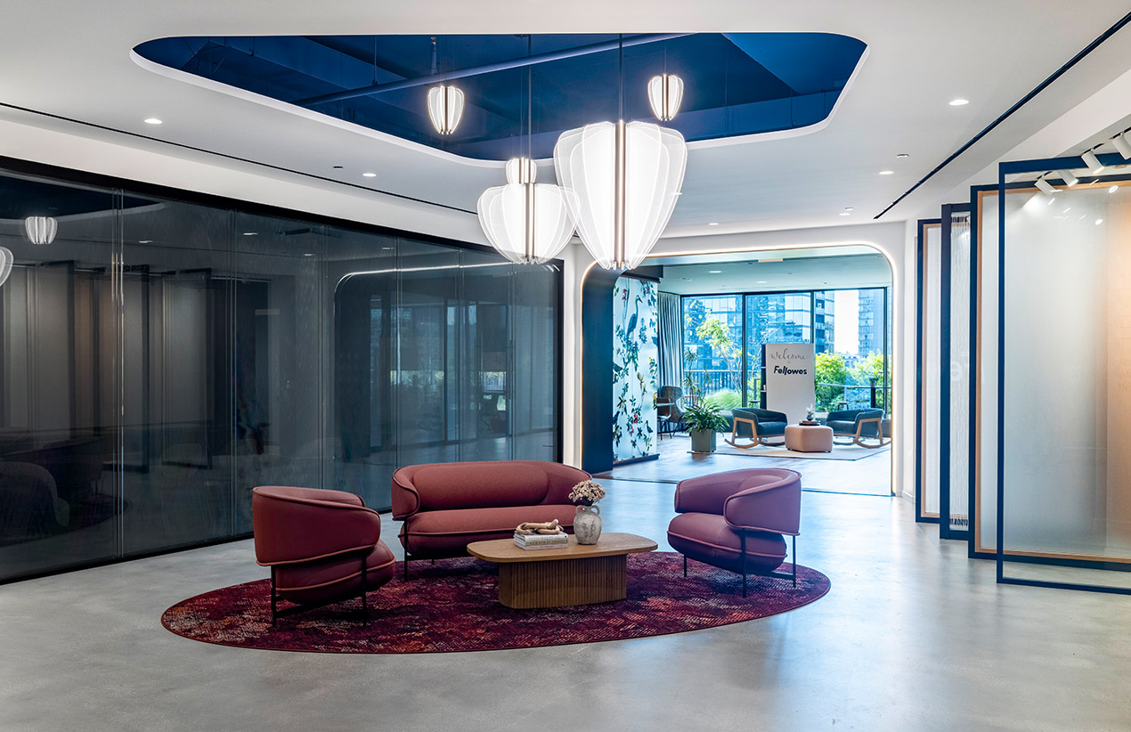 A Woman walking in a lobby area