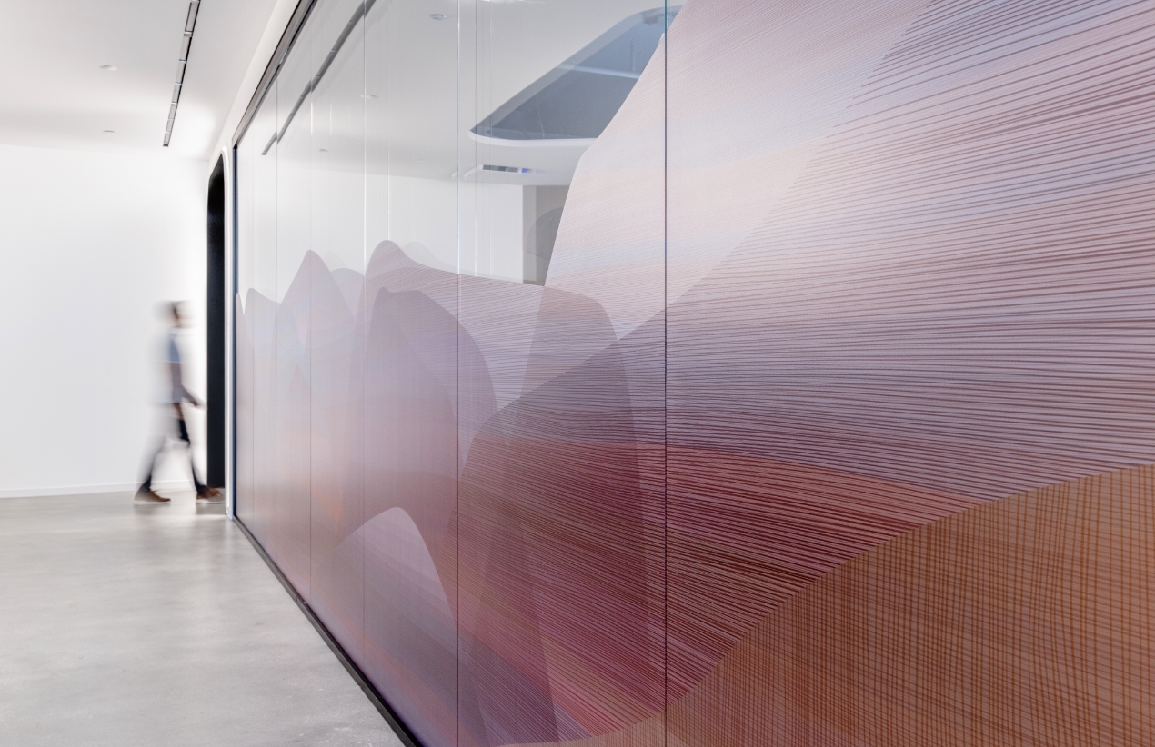 Man walking in office hallway