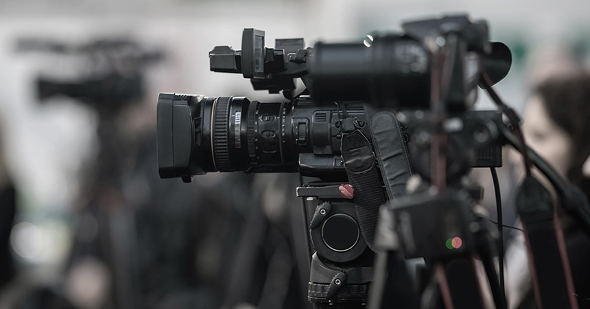 Image of a broadcasting camera at a news event