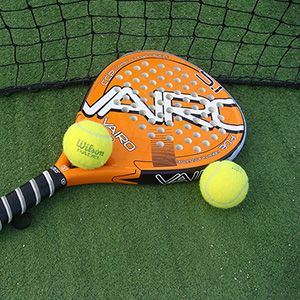 Image of Paddleball paddels and ball on the ground