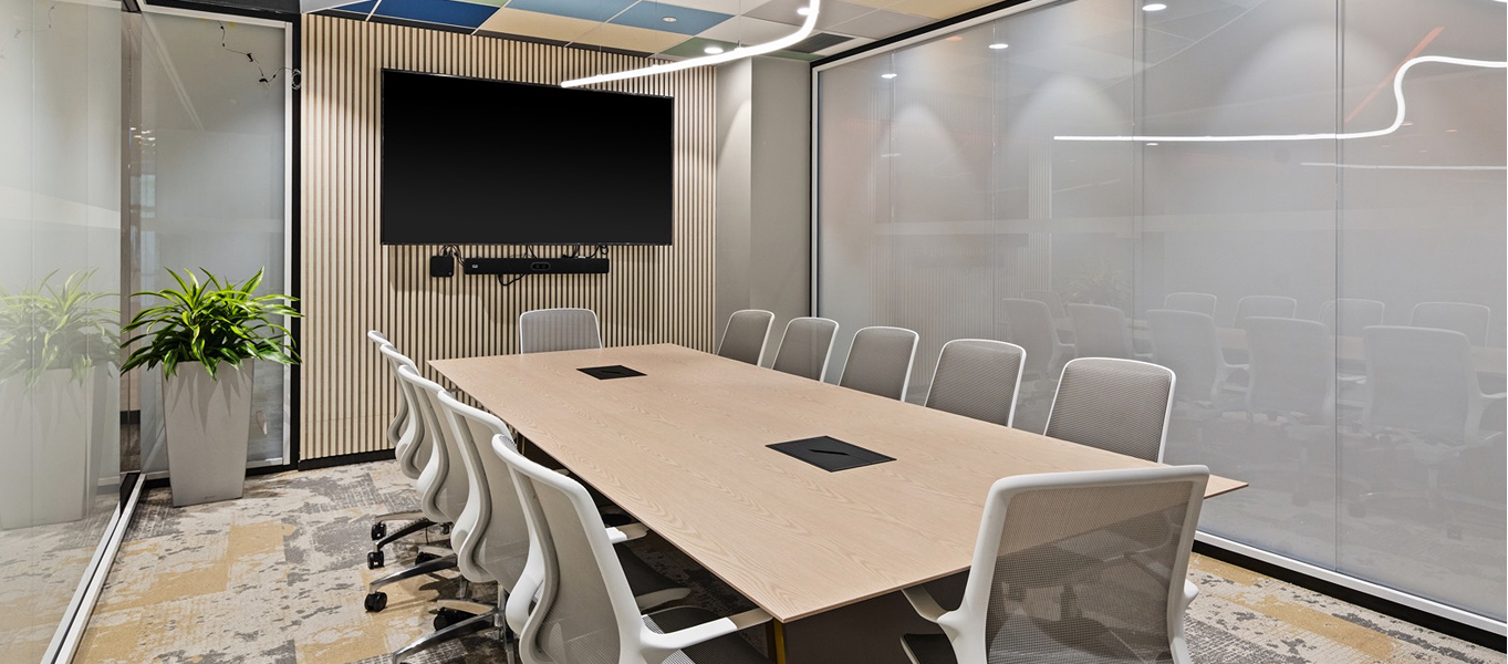 Image of a conference room built using Titan Walls, Elea Seating, and a Zona Conference Table